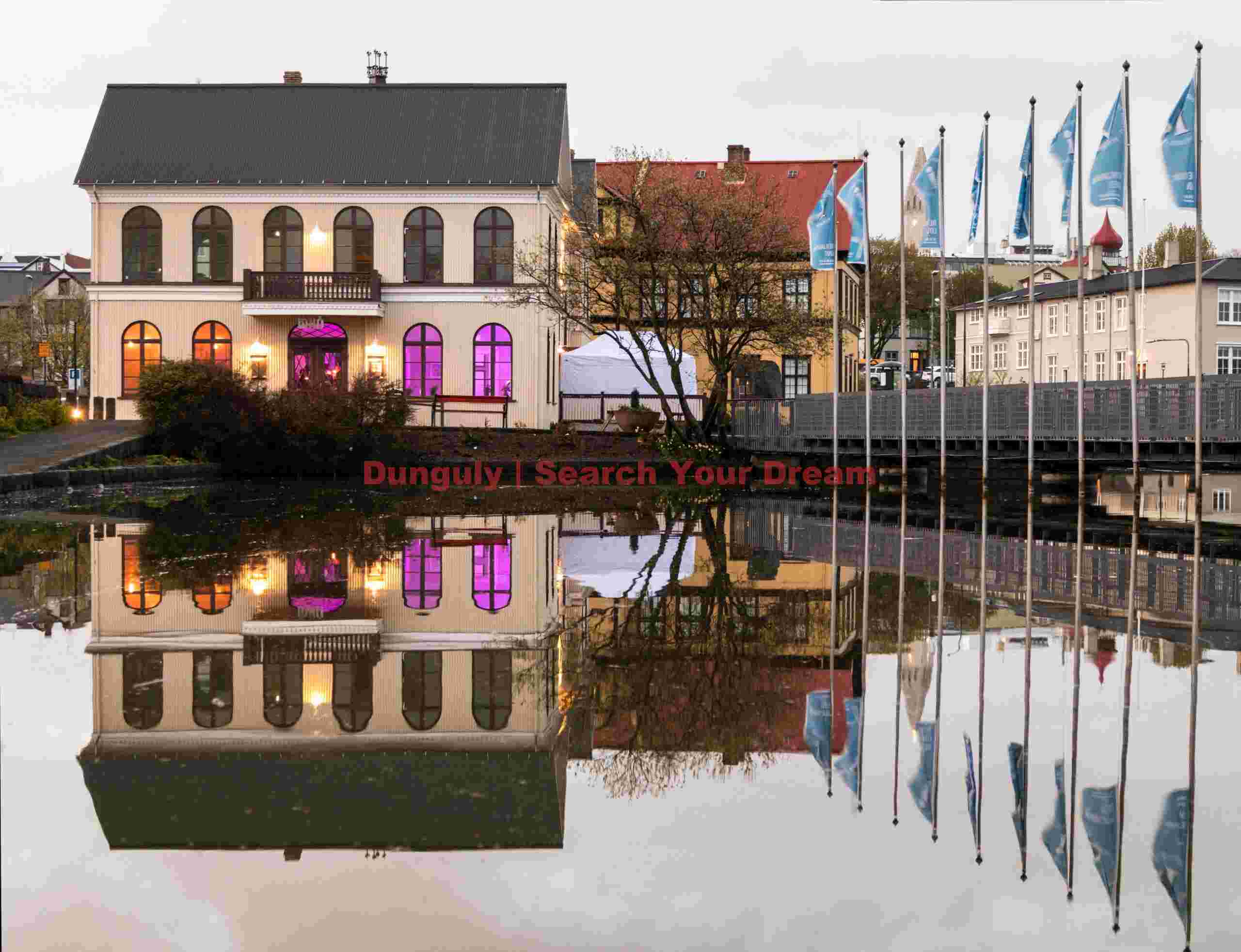 Colorful house and flagpoles; Reykjavík