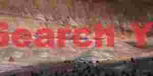 Dappled Shadows Dance Across Colorful Badlands