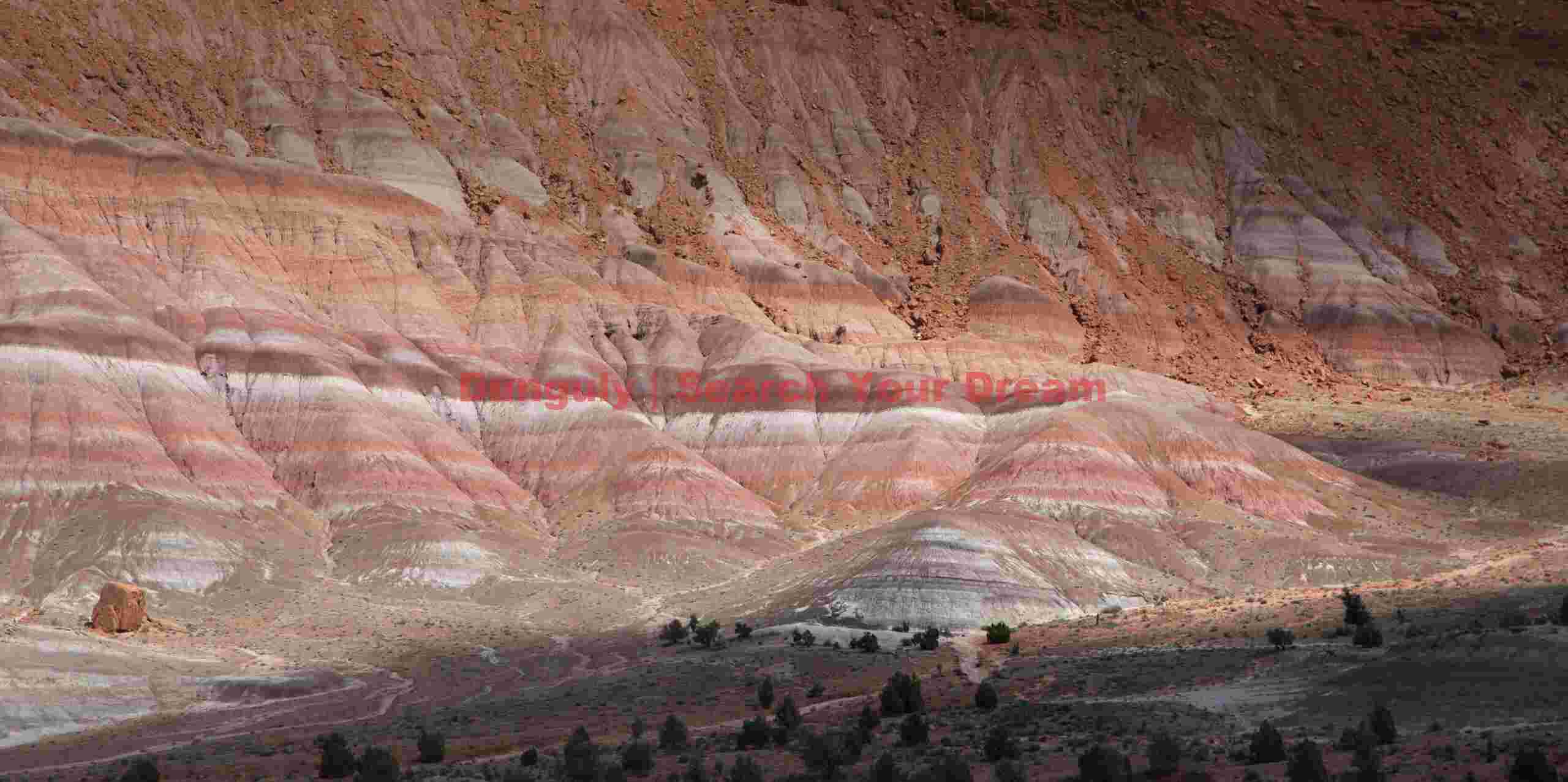 Dappled Shadows Dance Across Colorful Badlands
