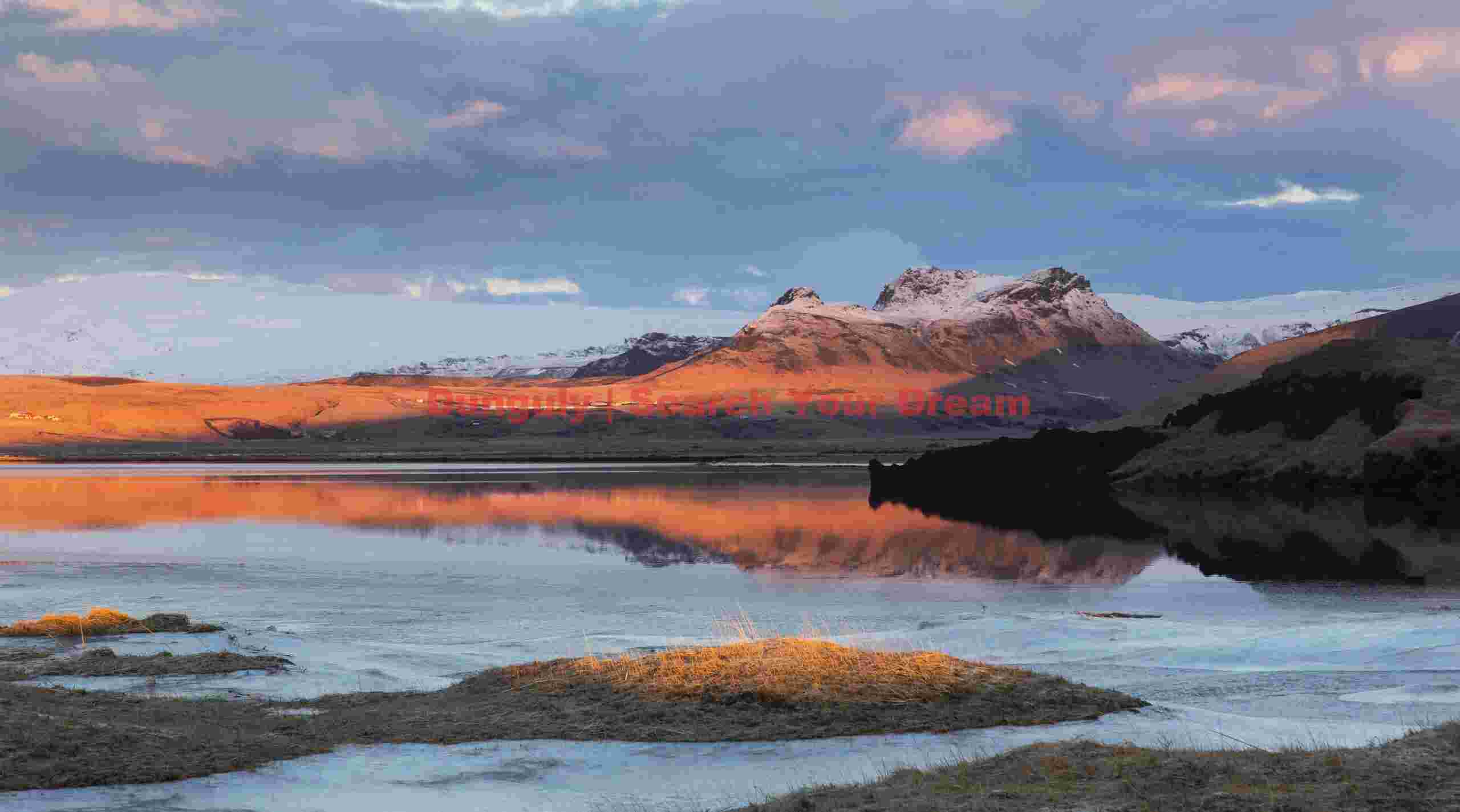 Glacial Ice Formation at Dyrholaeylagoon at sunrise