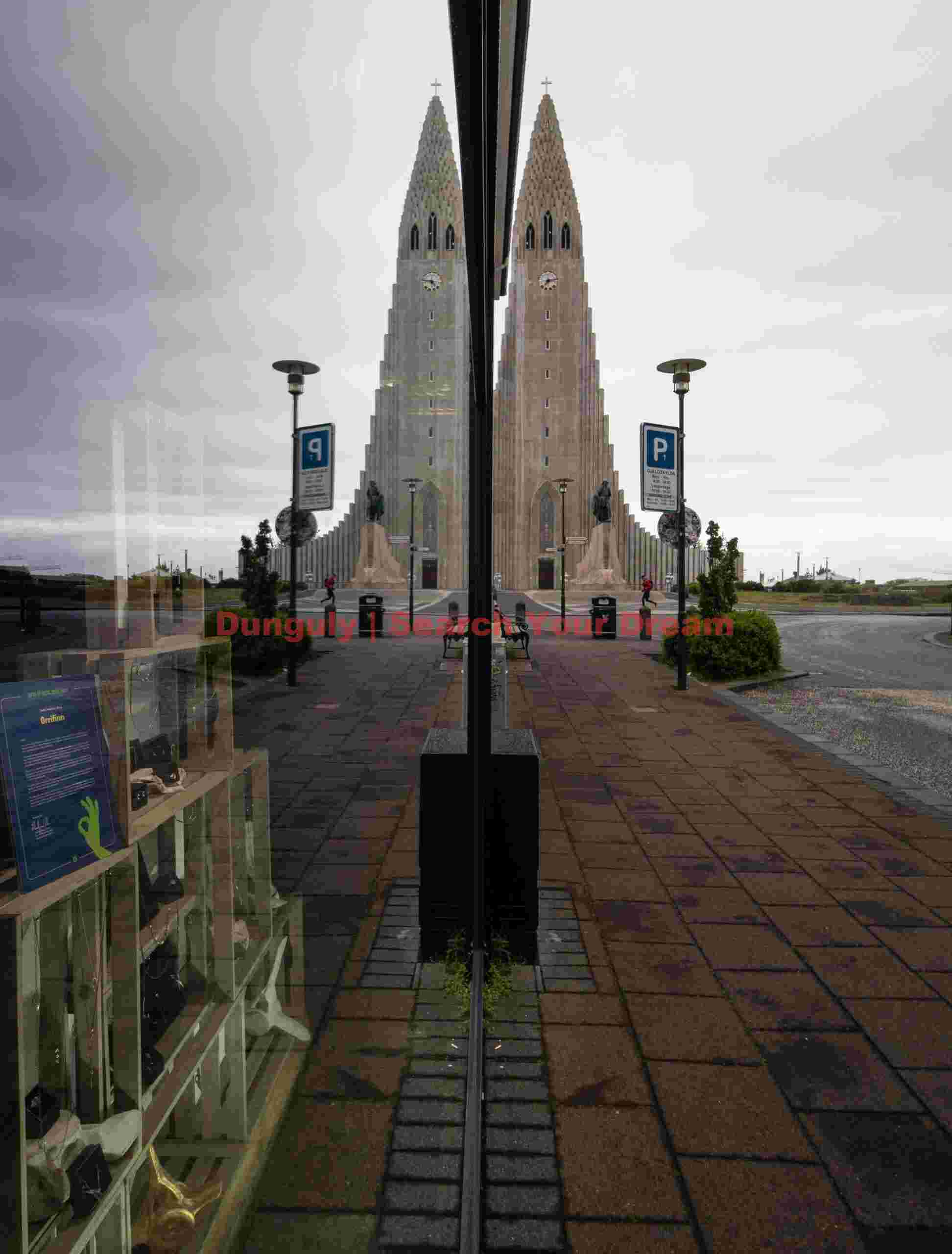 Hallgrimskirkja reflection in shop window; Reykjavik