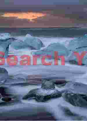 Glacial Ice Formation at Jokelbergs with receding surf, Jokulsa beach, South Iceland