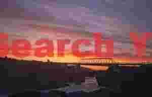 Midnight sun, old bridge below Godafoss