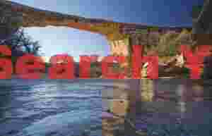 Owachomo Natural Bridge Illuminated by Frozen Sunrise Light