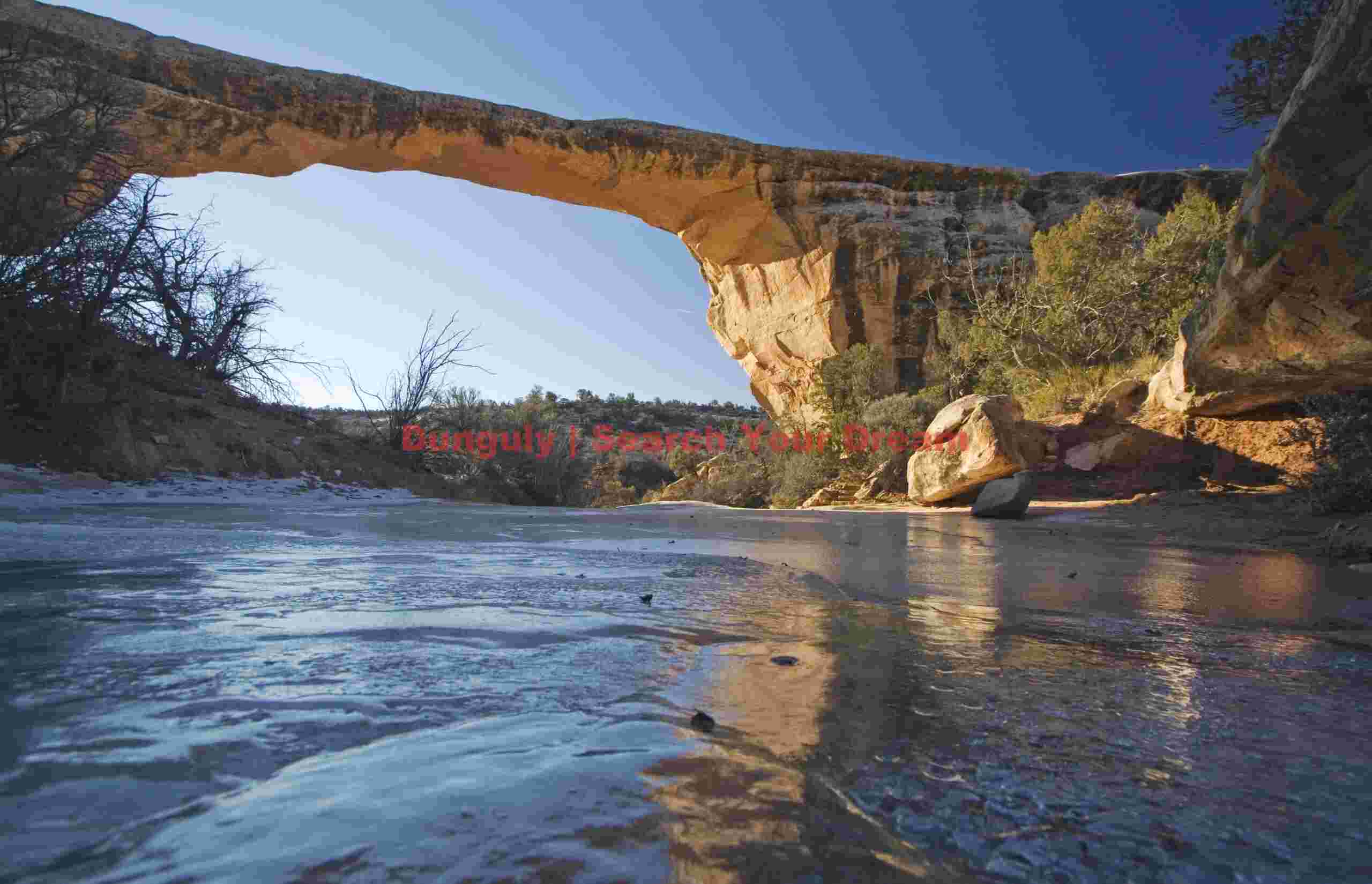 Owachomo Natural Bridge Illuminated by Frozen Sunrise Light