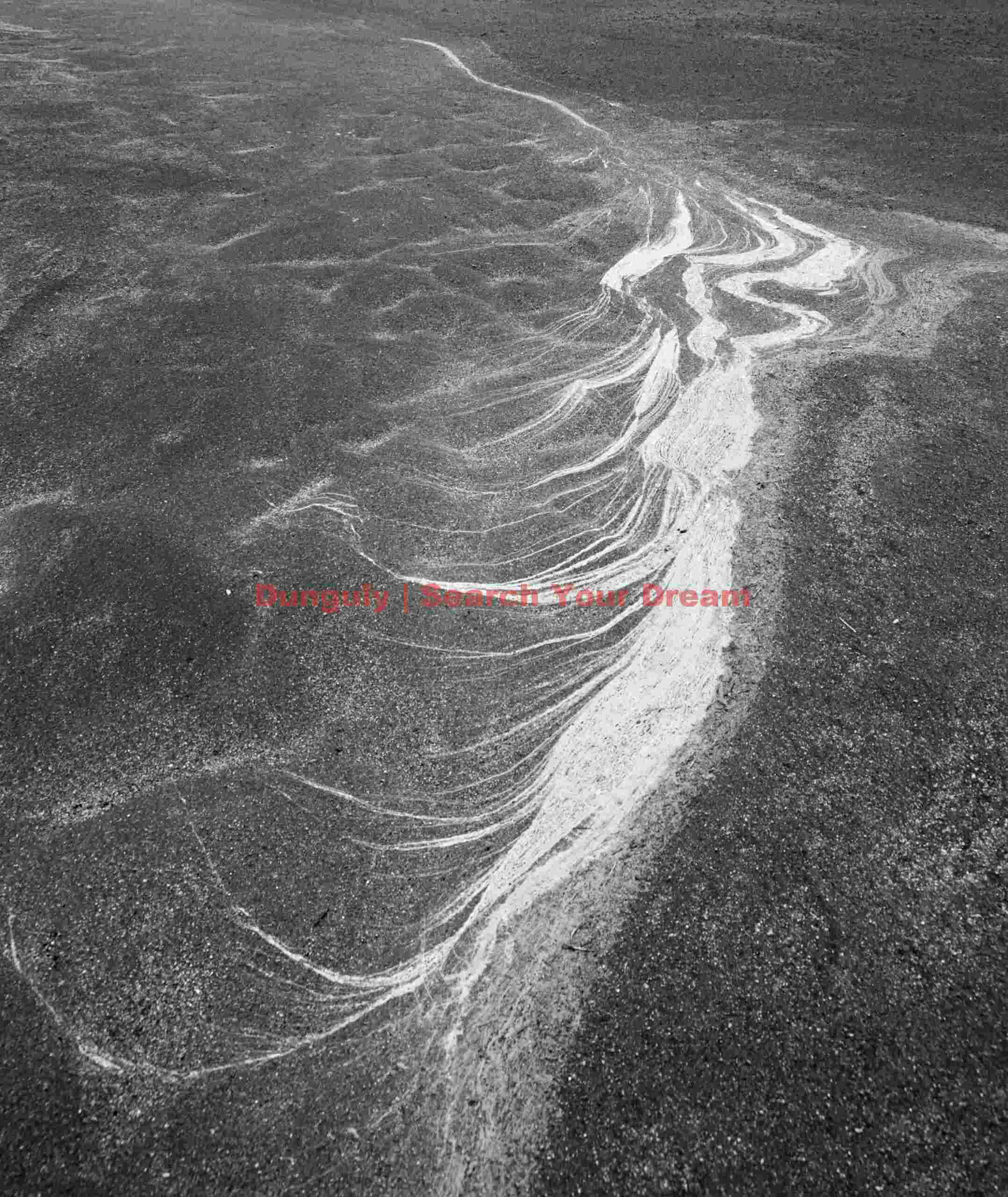 Glacial Ice Formation at Patterns in black sand
