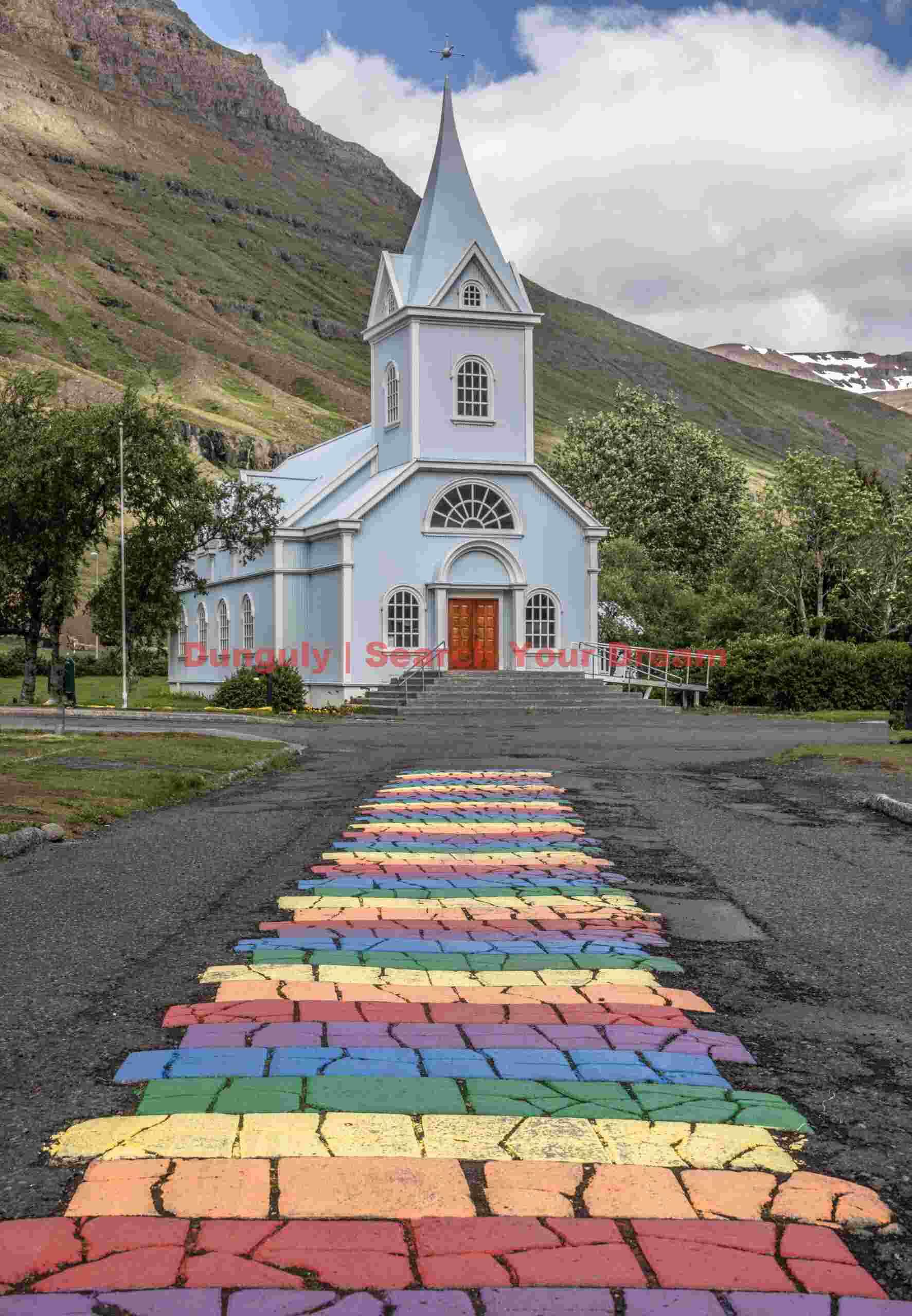 Rainbow path to Seyðisfjarðarkirkja church; E. Iceland