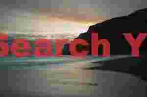 Reynisdrangar sea stacks with reflected sunset color; Vik, South Iceland