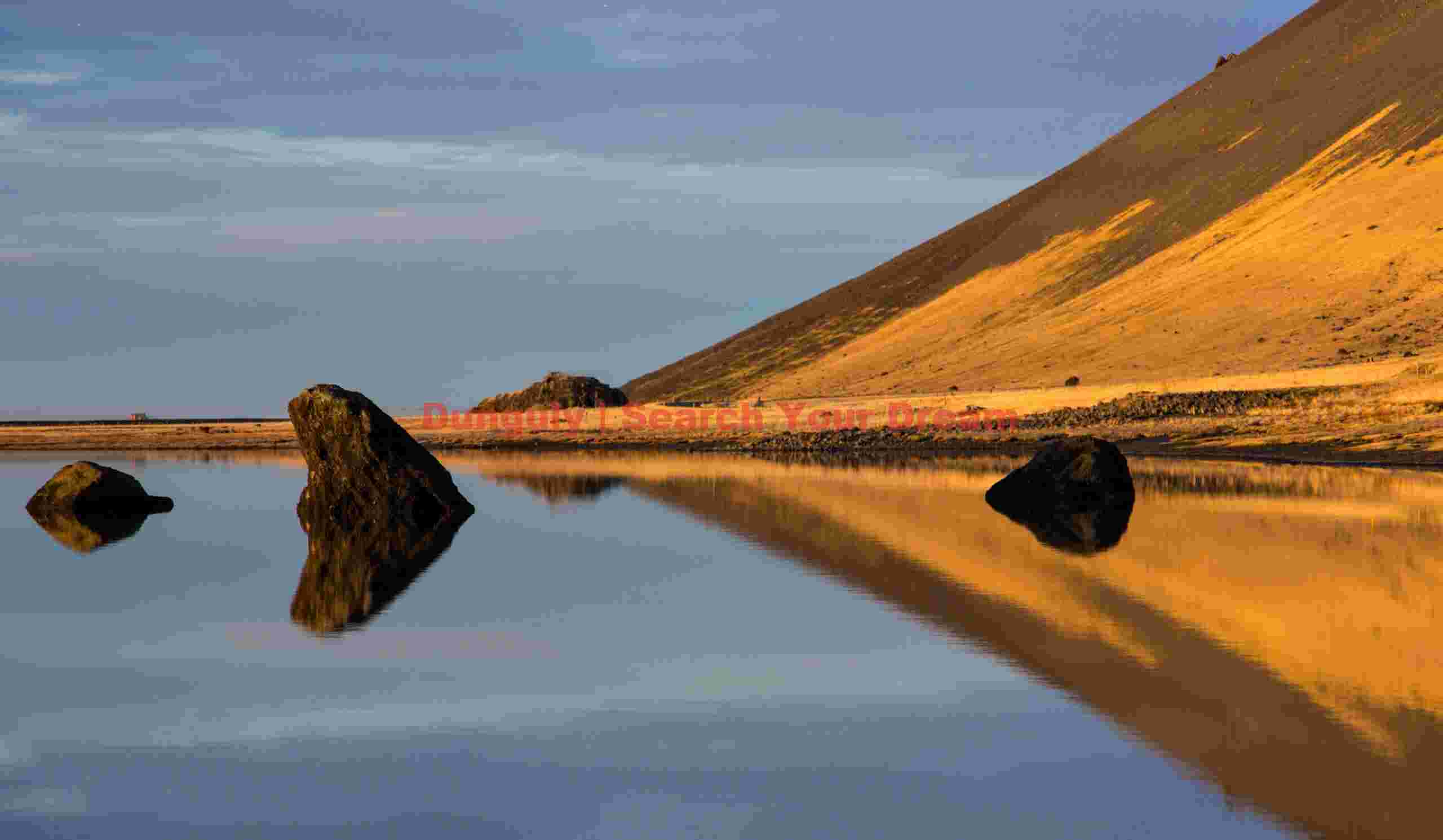 Glacial Ice Formation at Rorschach reflection with boulders