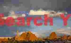 Sandstone Spire with Drifting Clouds - Kodachrome Basin