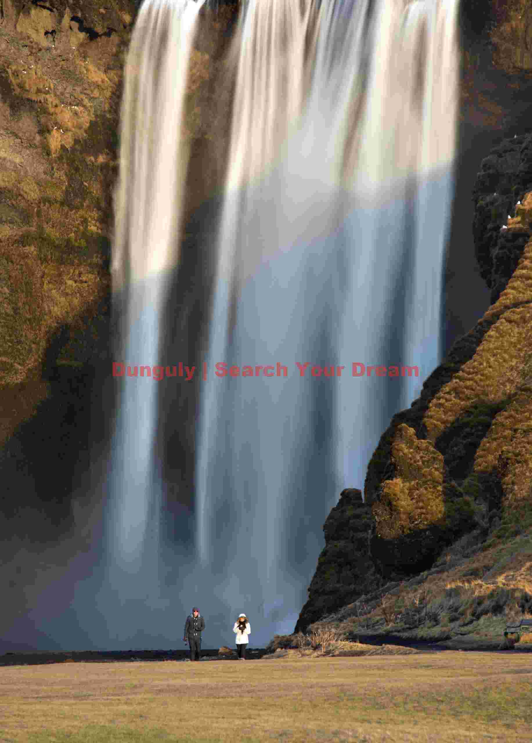 Skogafoss with tourists; South Iceland