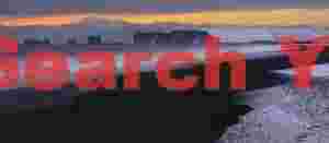 Snow, surf and sea arch; Dyrholaey