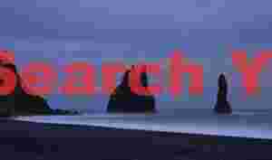 Snow, surf and sea stacks, Vik