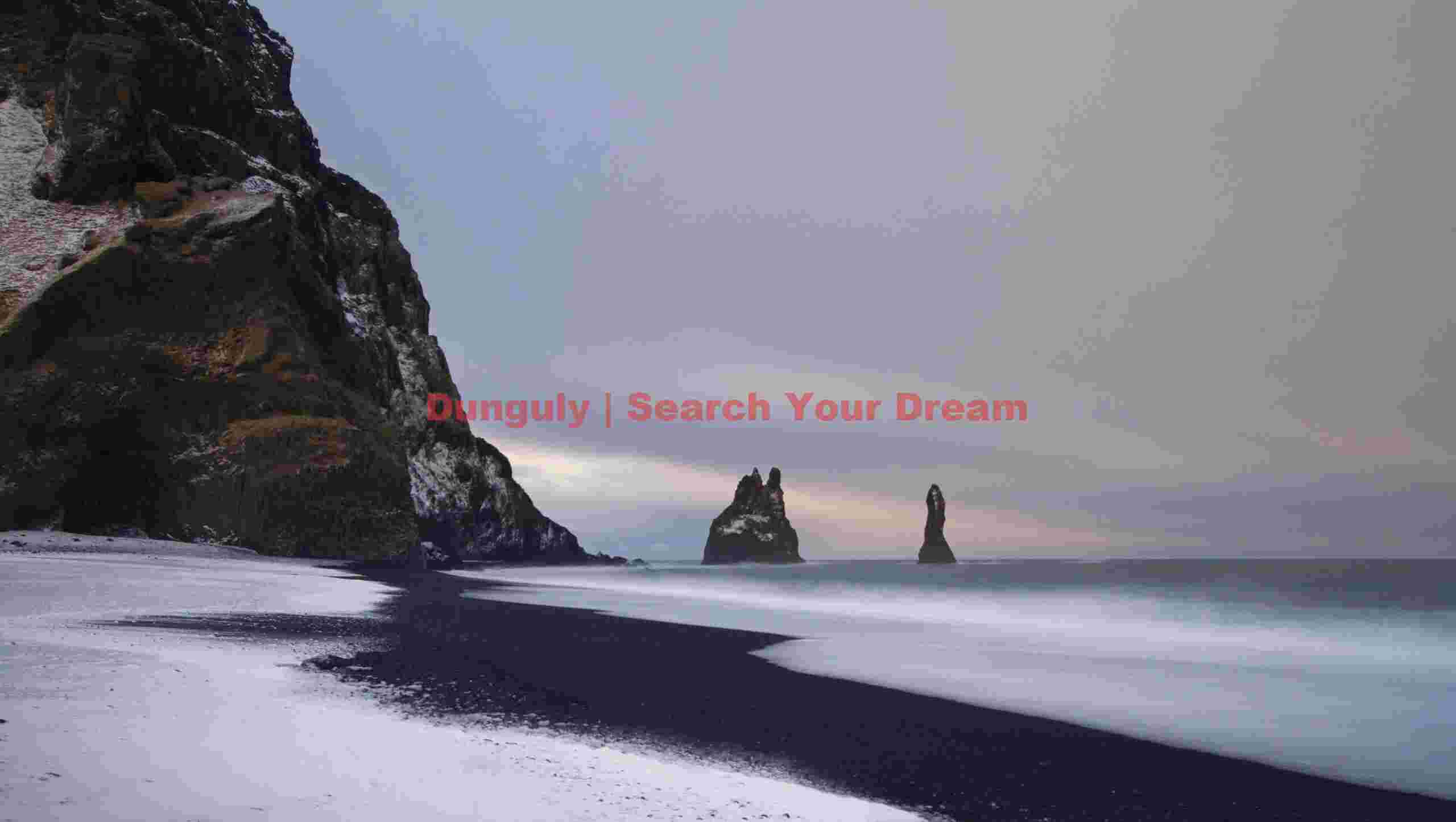 Snow, surf and sea stacks , Vik