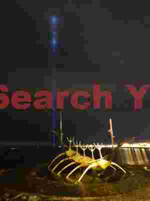 Solfar sculpture with John Lennon Peace Tower memorial; Reykjavik