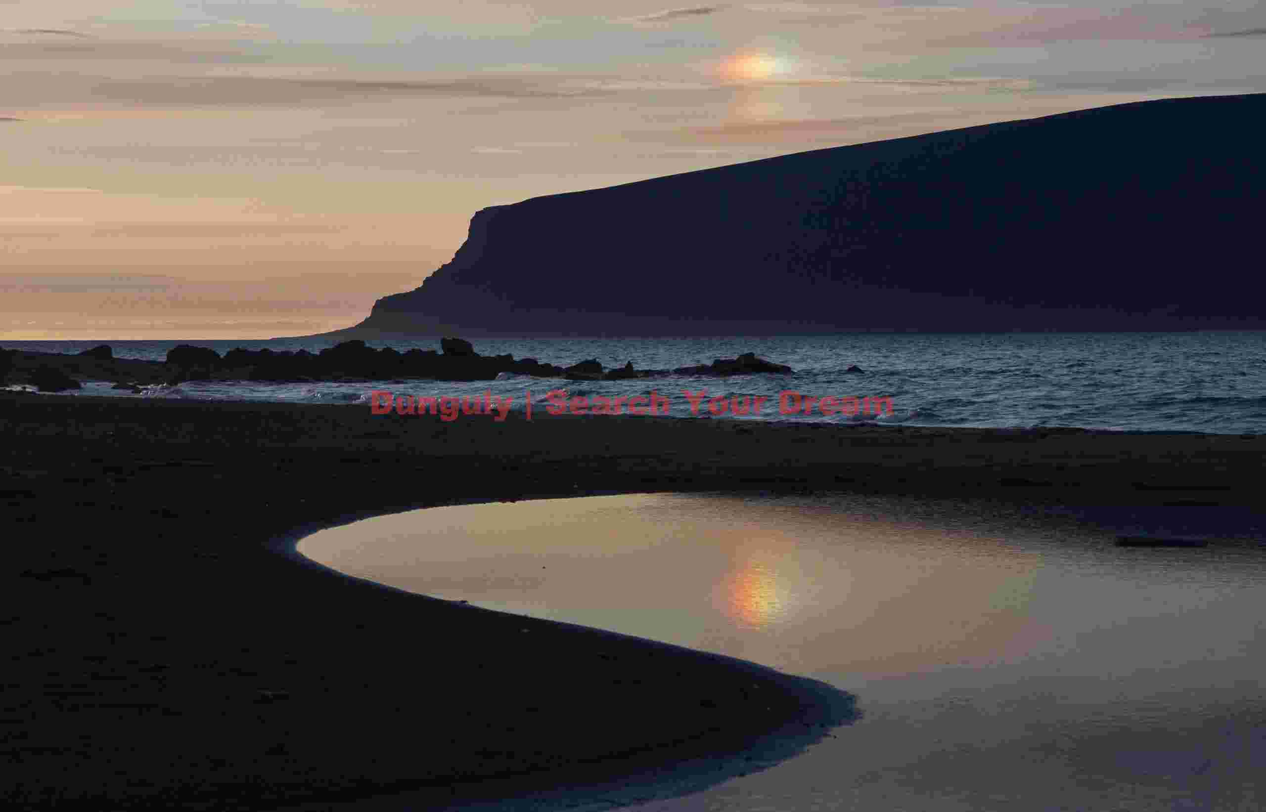 Sunset view across Dyrholaey lagoon; South Iceland