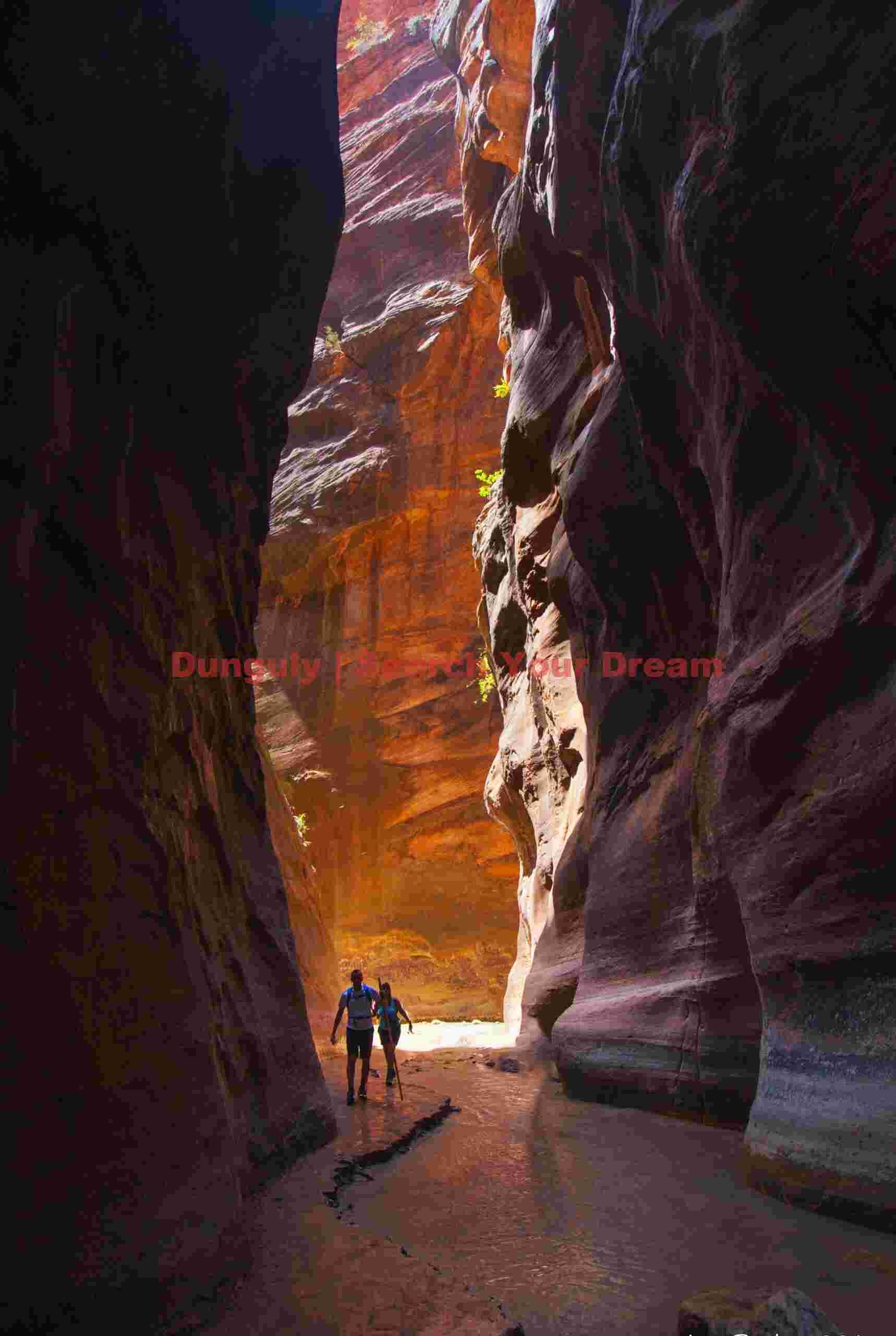 Two Figures Exploring the Virgin River Narrows