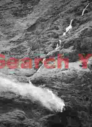 Waterfall blown sideways by gale-force winds; South Iceland