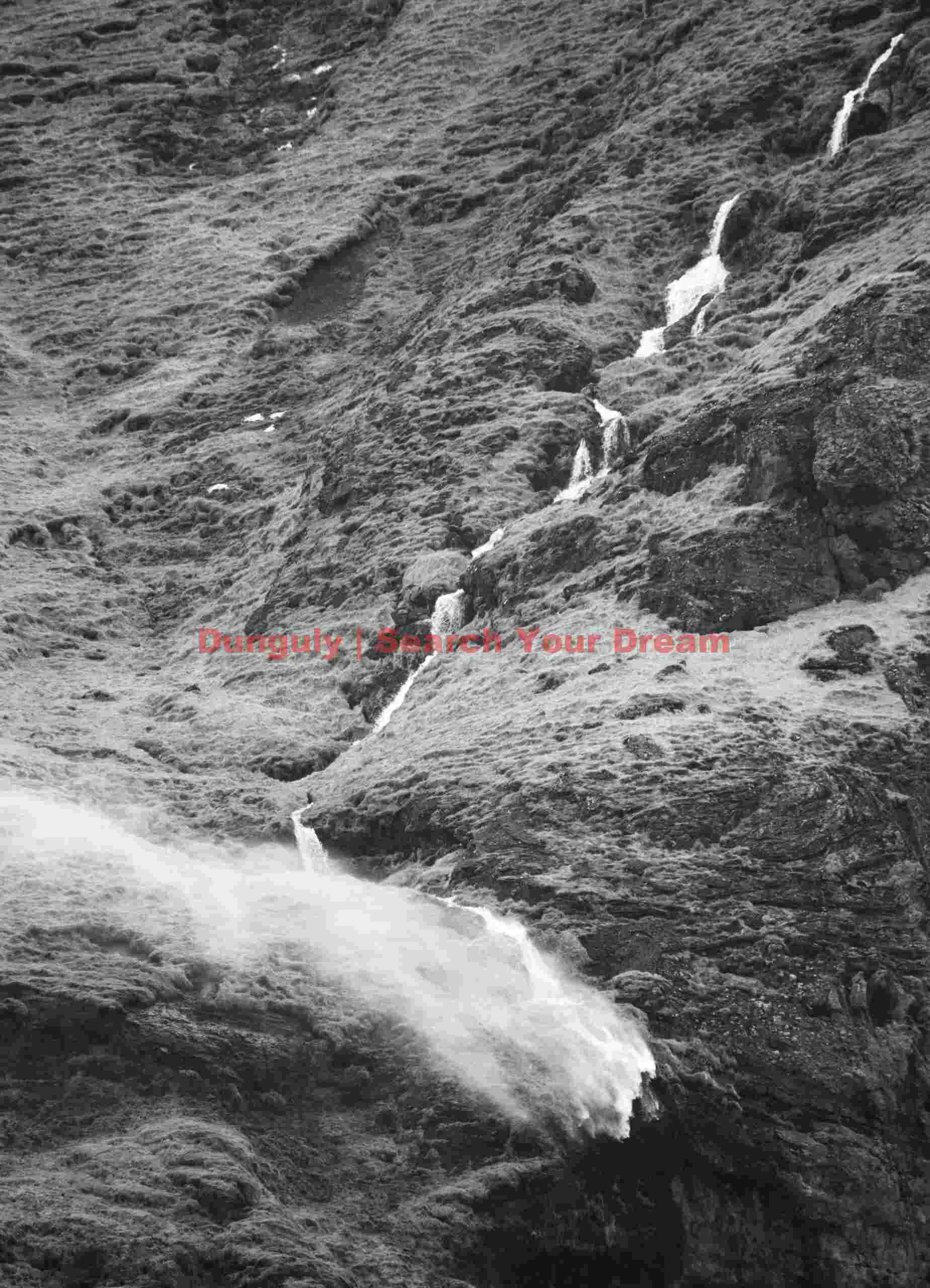 Waterfall blown sideways by gale-force winds; South Iceland