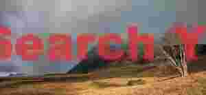 Wild cloudscape above abandoned farmsite; South Iceland