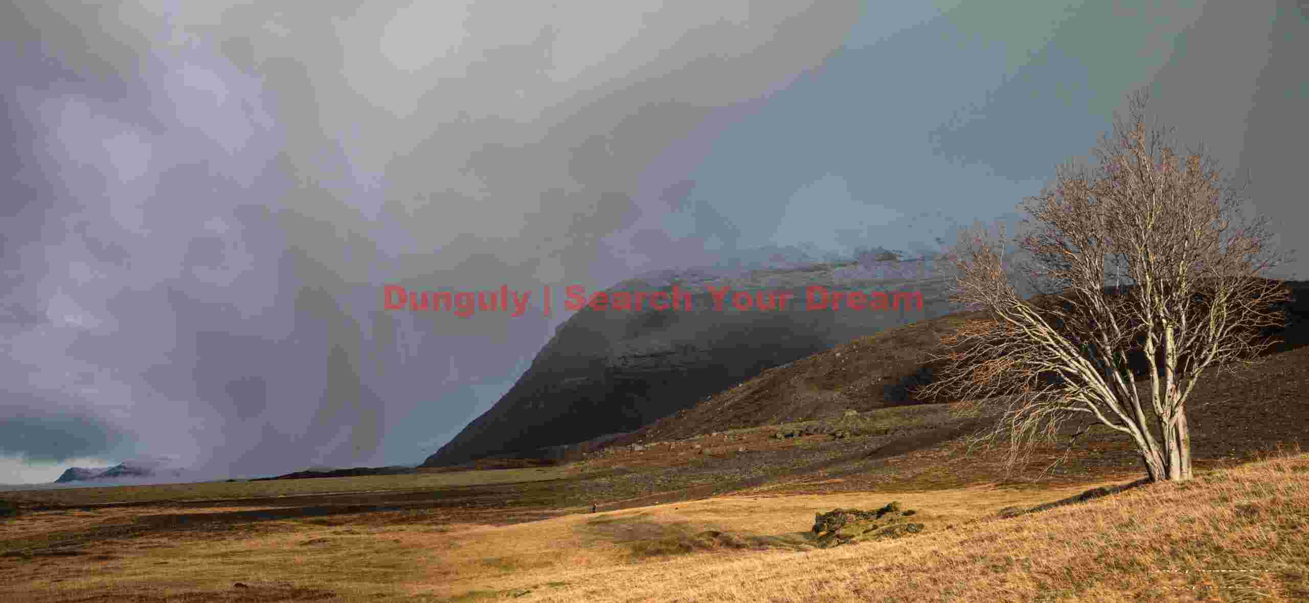 Wild cloudscape above abandoned farmsite; South Iceland