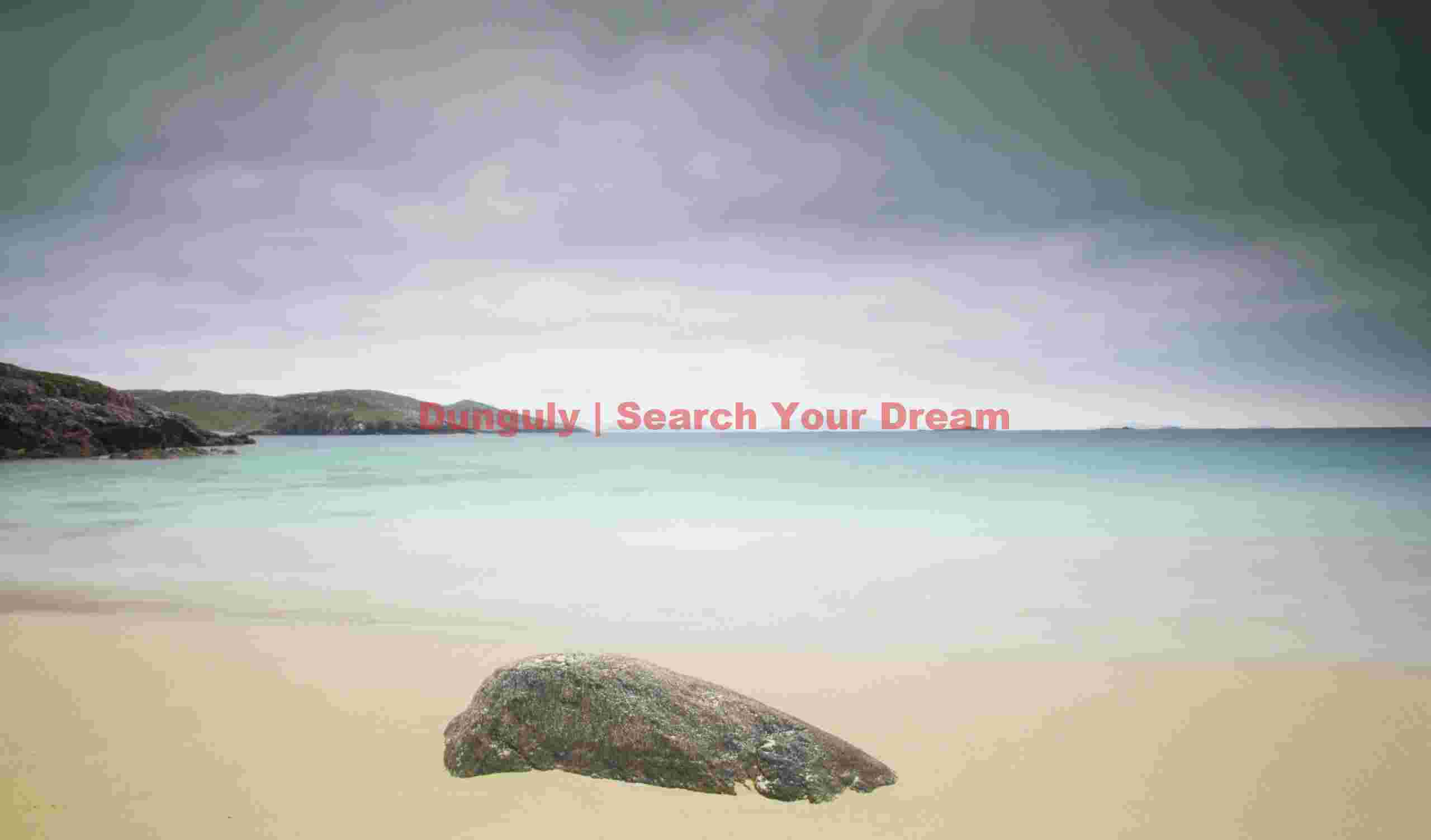 Aquamarine sea, beach and single boulder