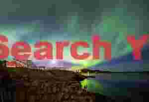 Aurora and moonrise over fish drying racks