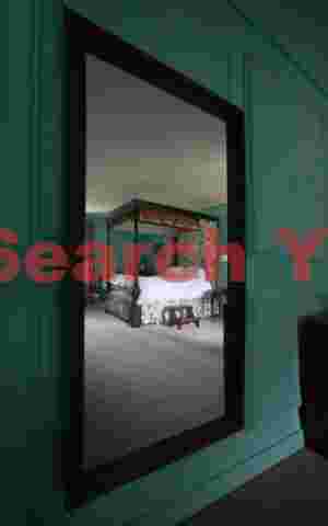 Bed reflection on mirror