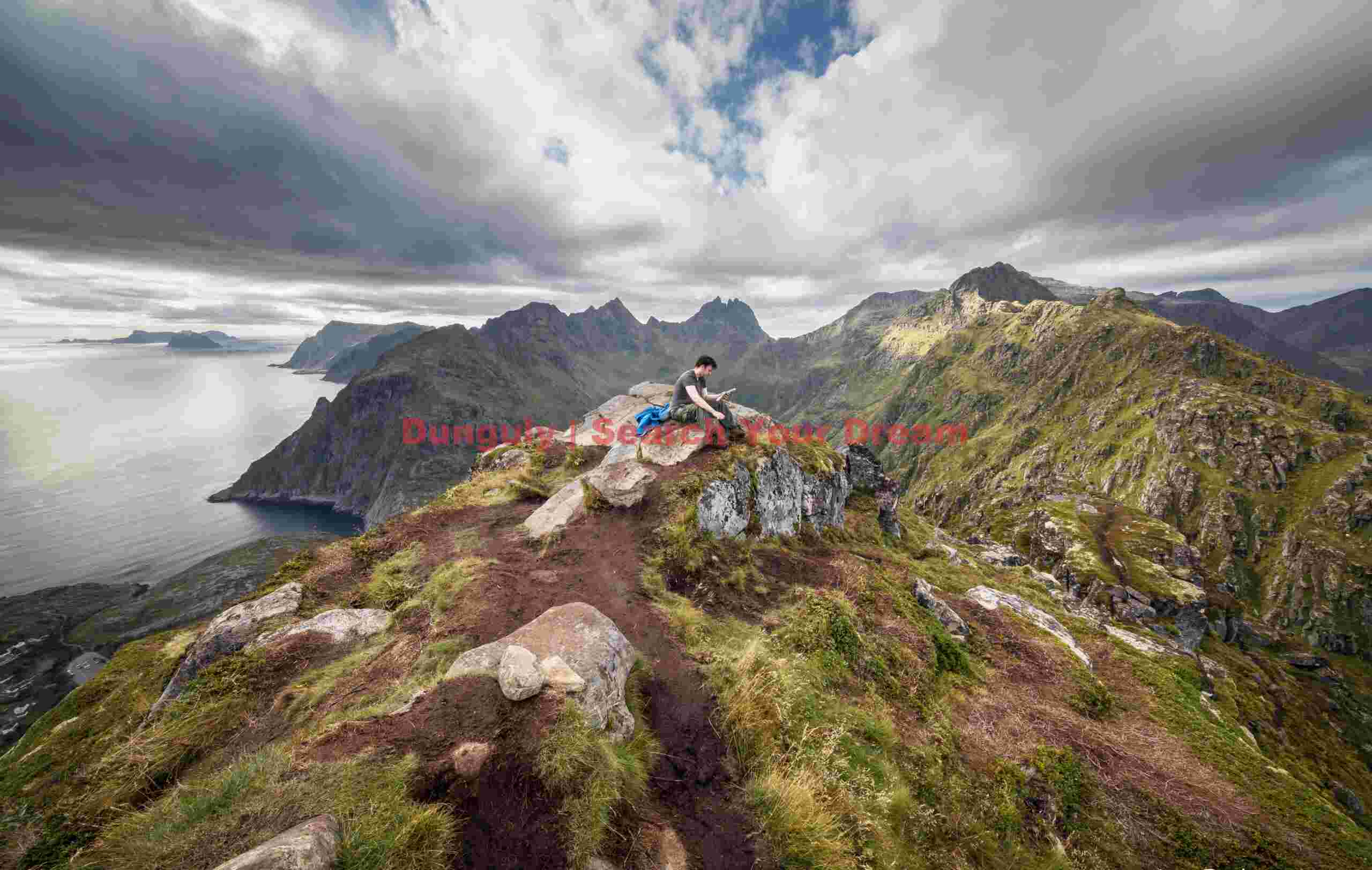 Cameron on top of the mountain above Tind