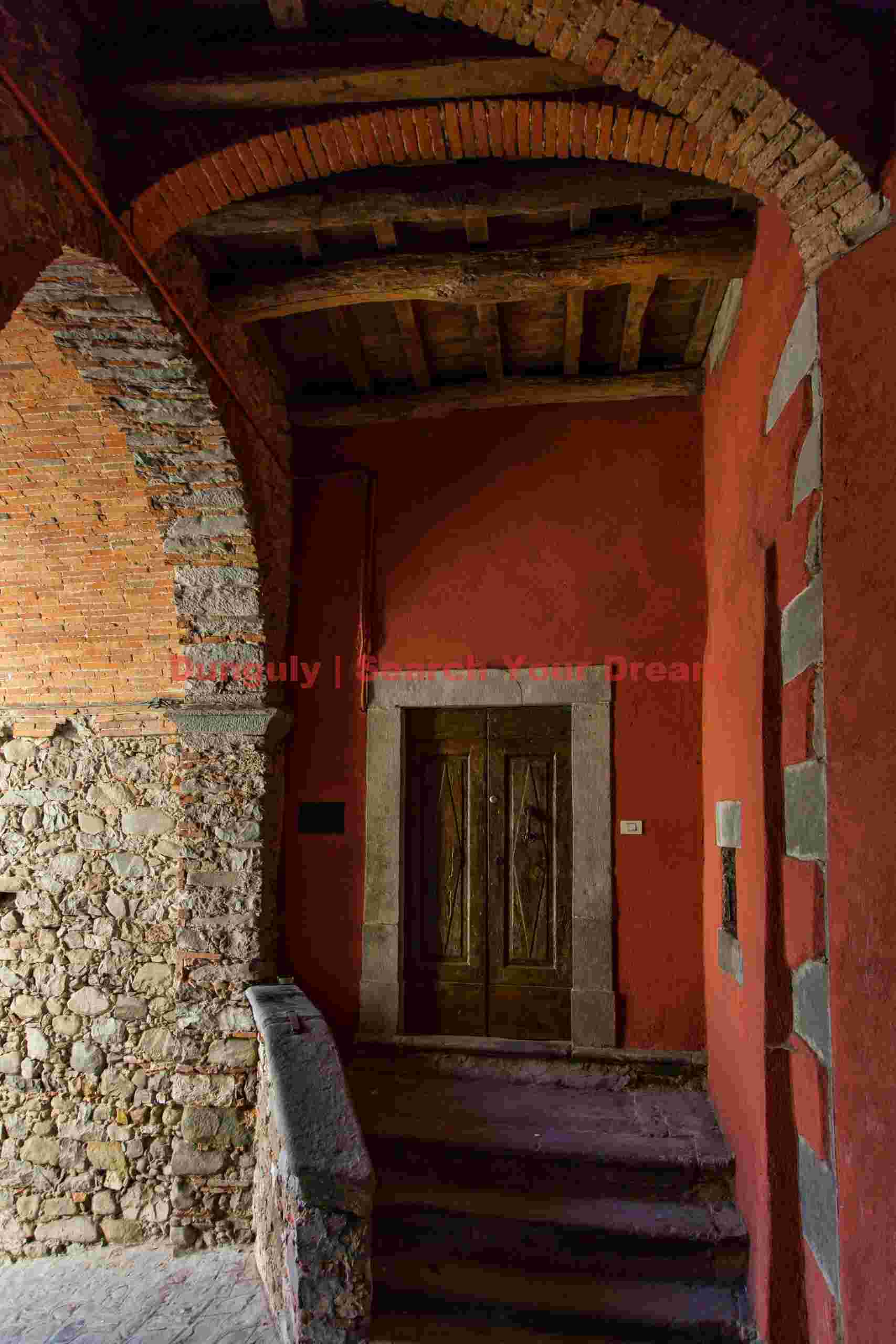 Doorway under red arches