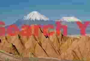 Licancabur and eroded badlands - Valle de la Luna