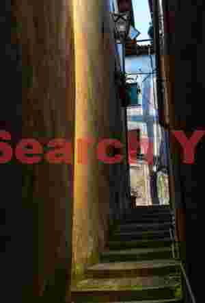 Narrow alley with reflected light