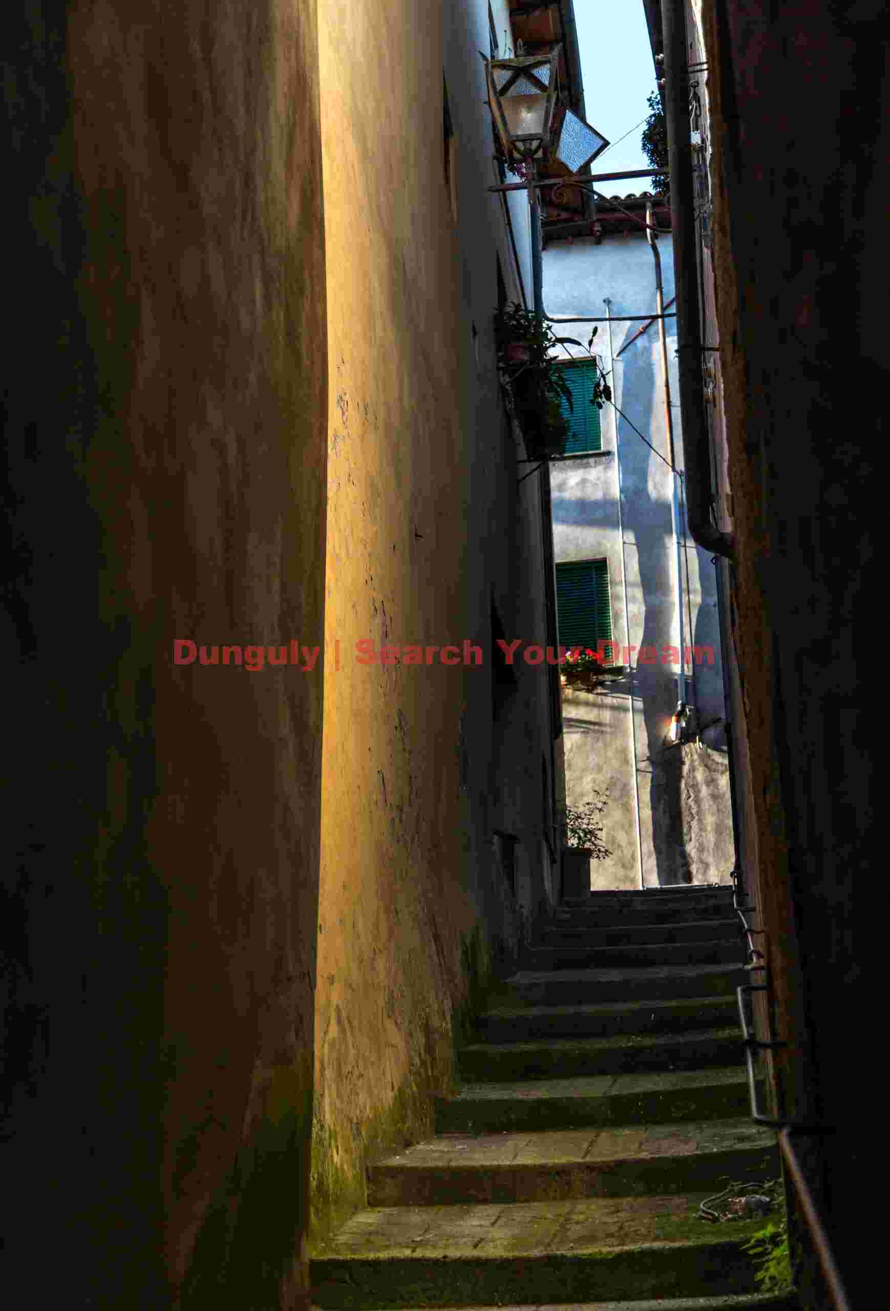 Narrow alley with reflected light