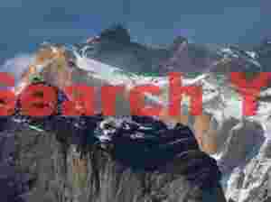 Orange granite topped by dark sedimentary rock