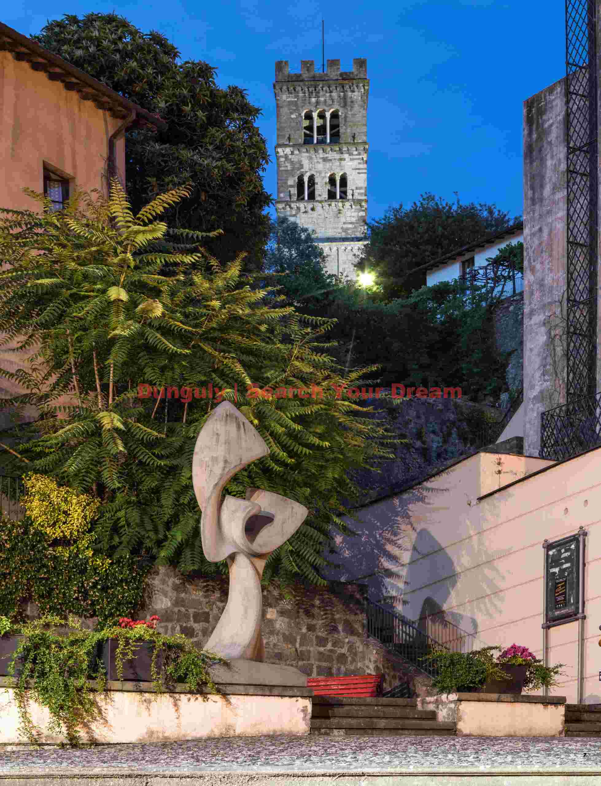 Sculpture and Duomo nightscape