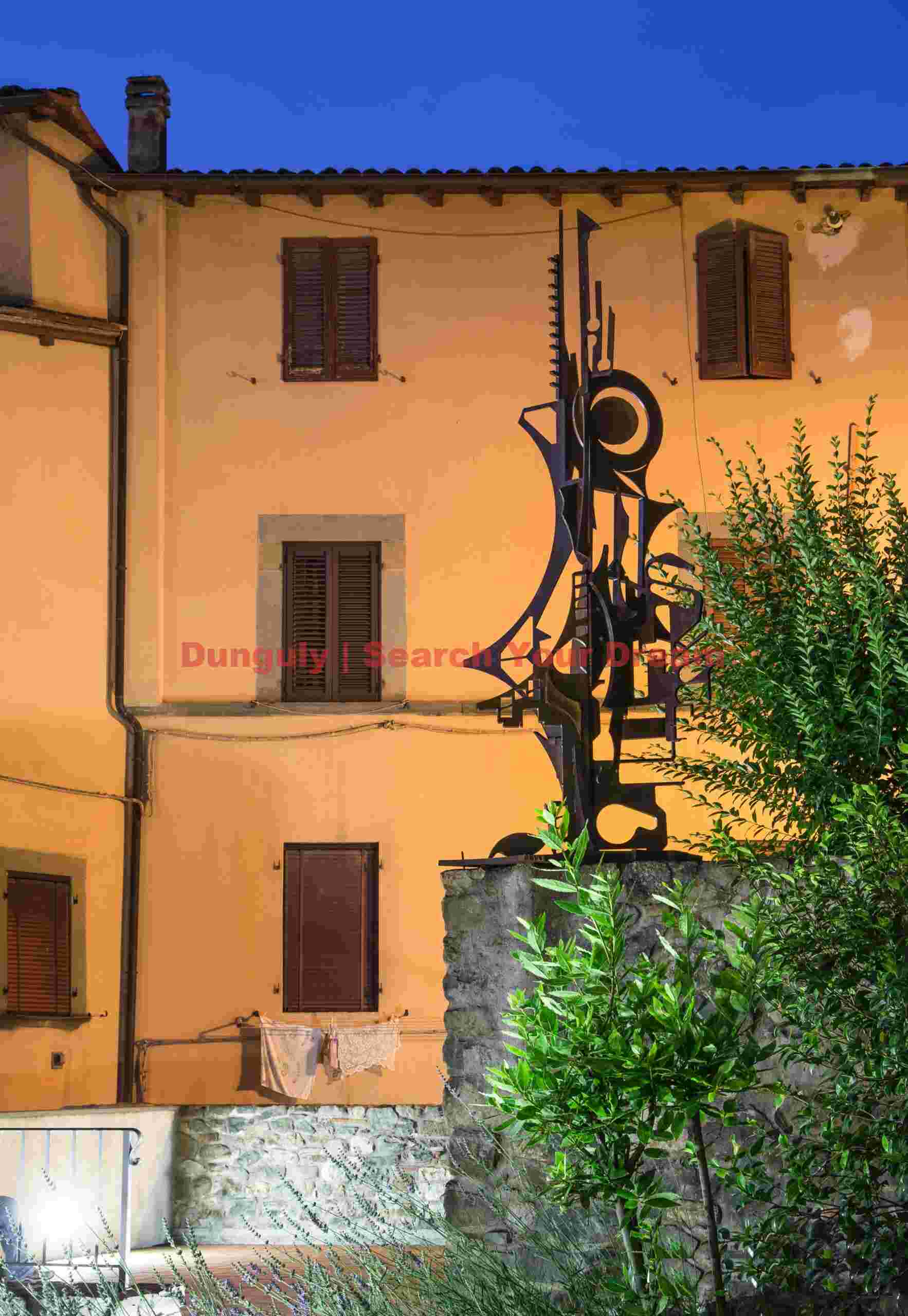 Sculpture and orange wall