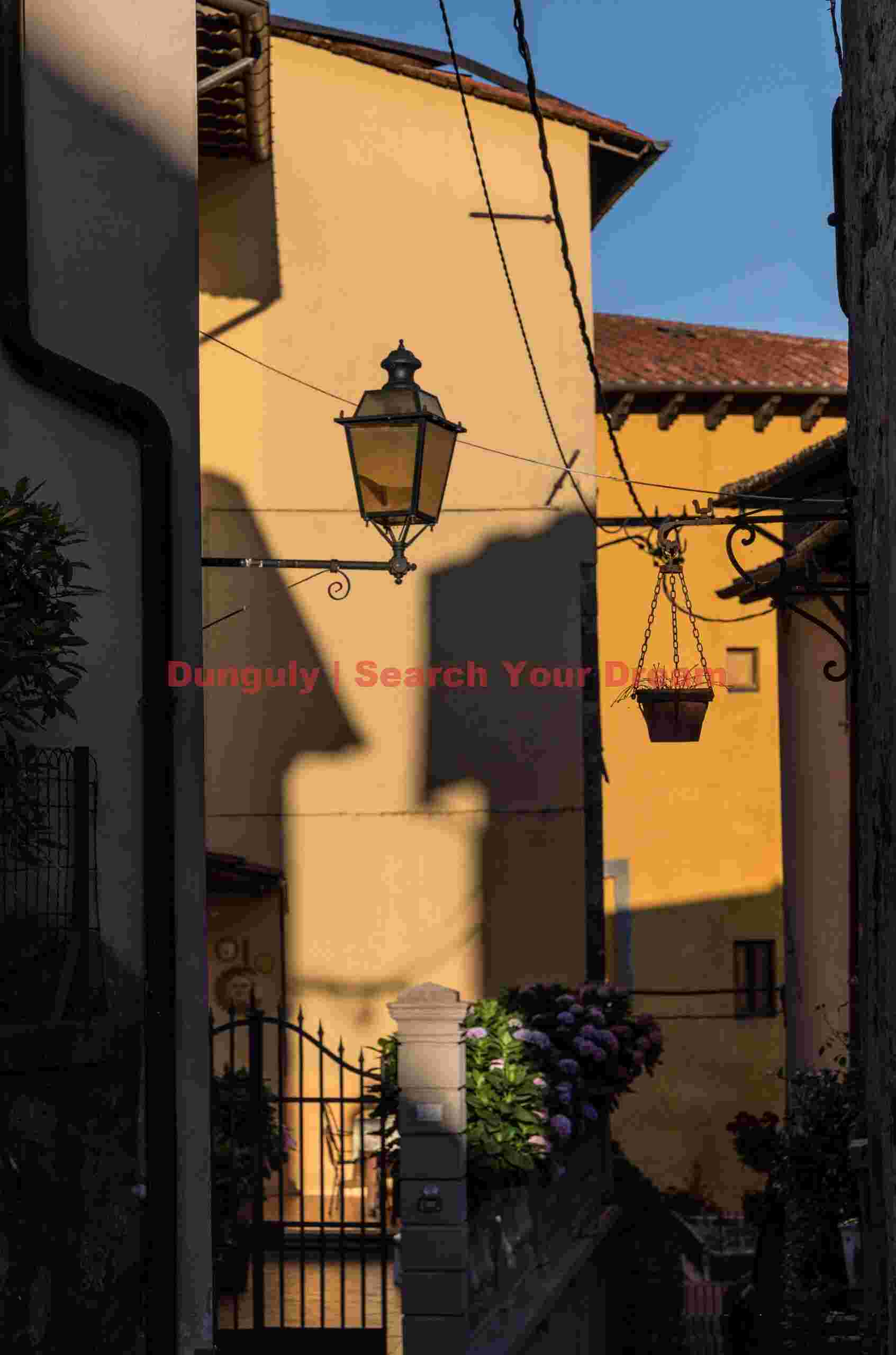 Streetlamp illuminated by sunray