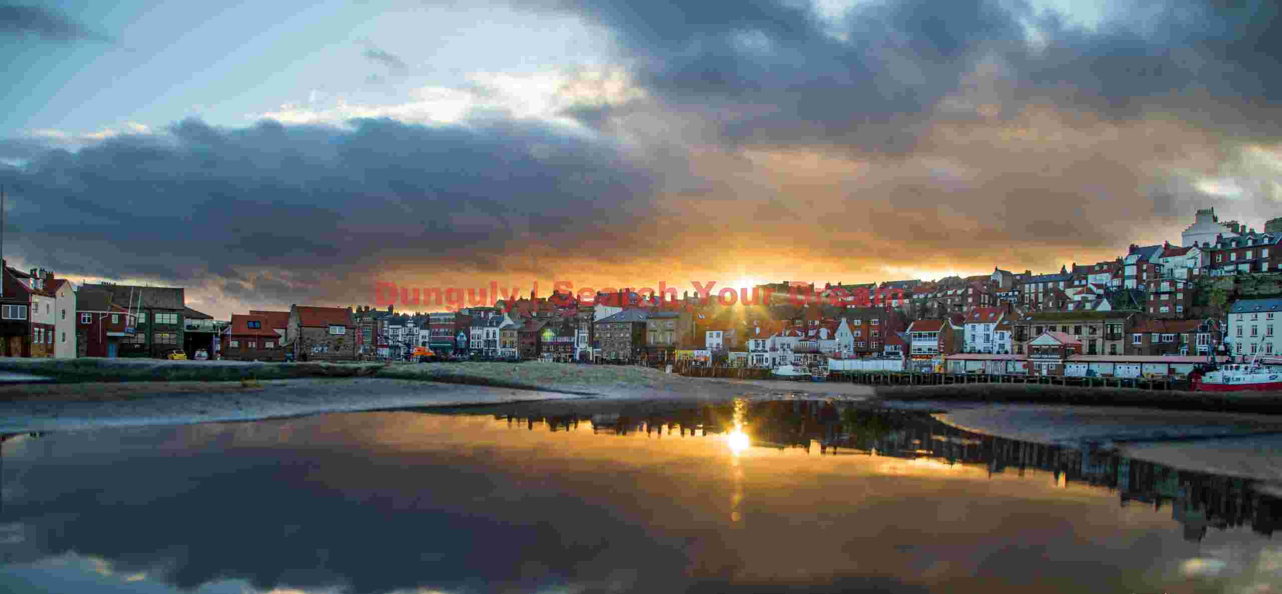 Sunset reflection in an infinity rain puddle