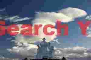 Waterfront statue and lenticular cloud, Ushuaia