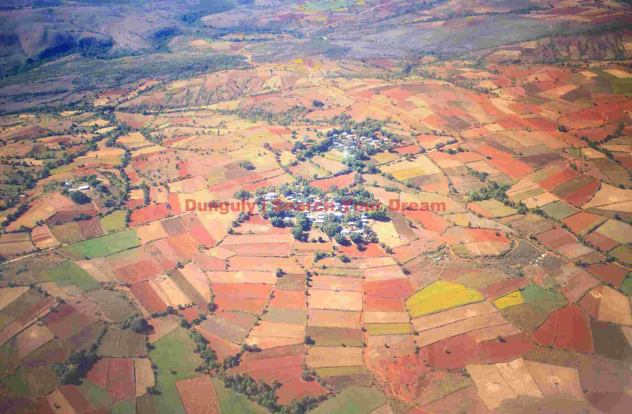 Ariel photo; Patchwork quilt of fields around Burmese village
