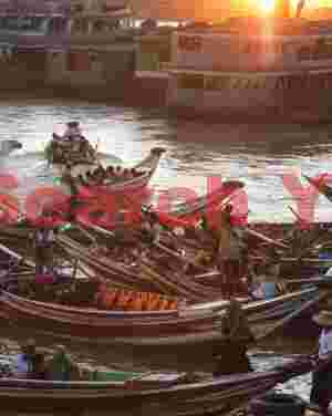 Ayerwaddy ferryboats under sunset light
