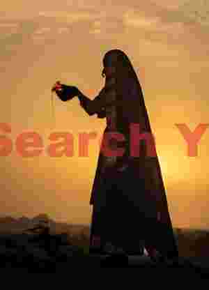 Backlit woman pouring water