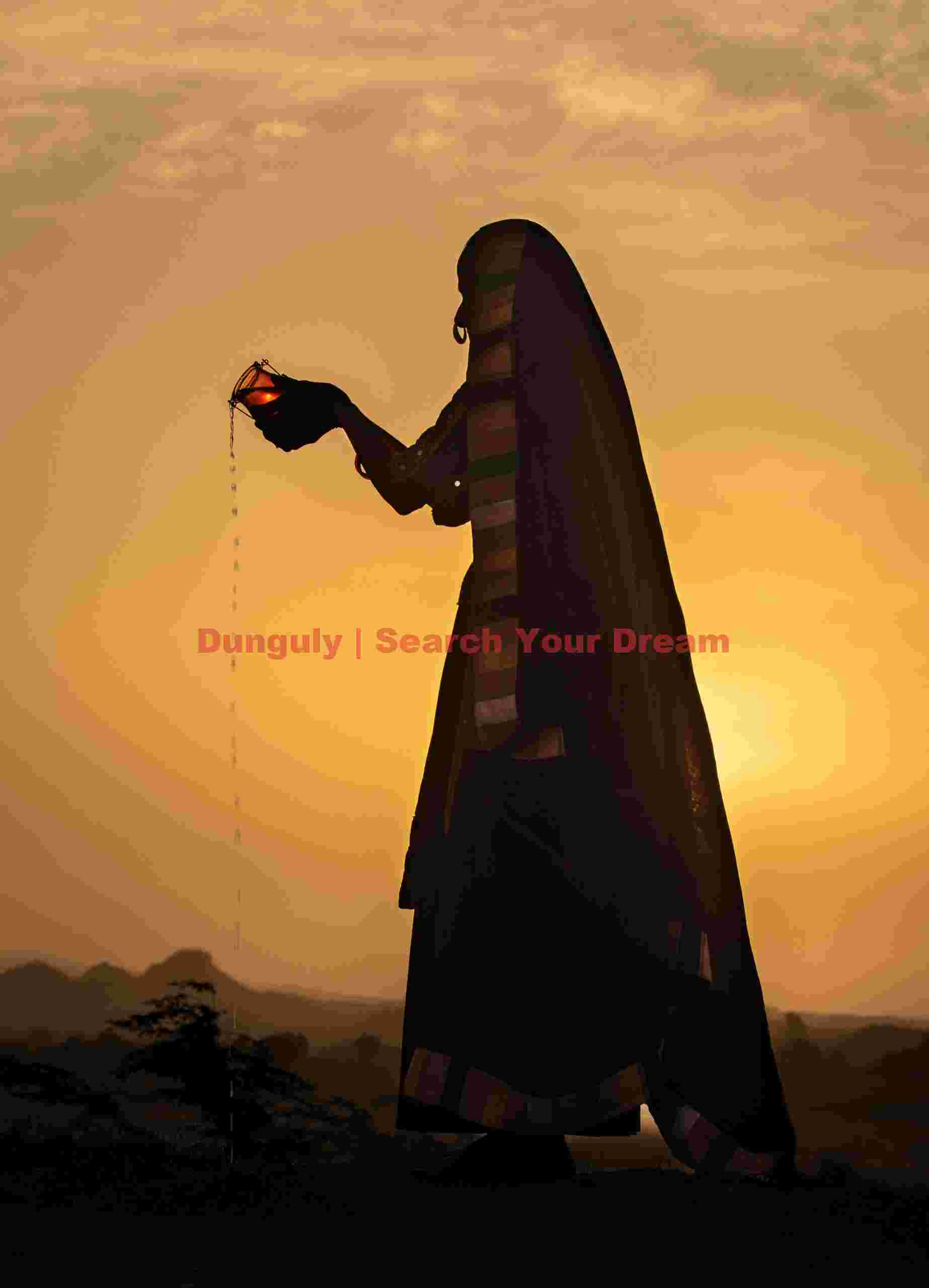 Backlit woman pouring water