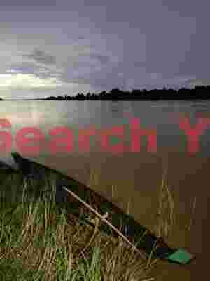 Boat at twilight , Mekong River, Laos