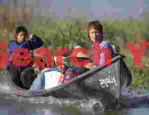 Boat ferrying workers