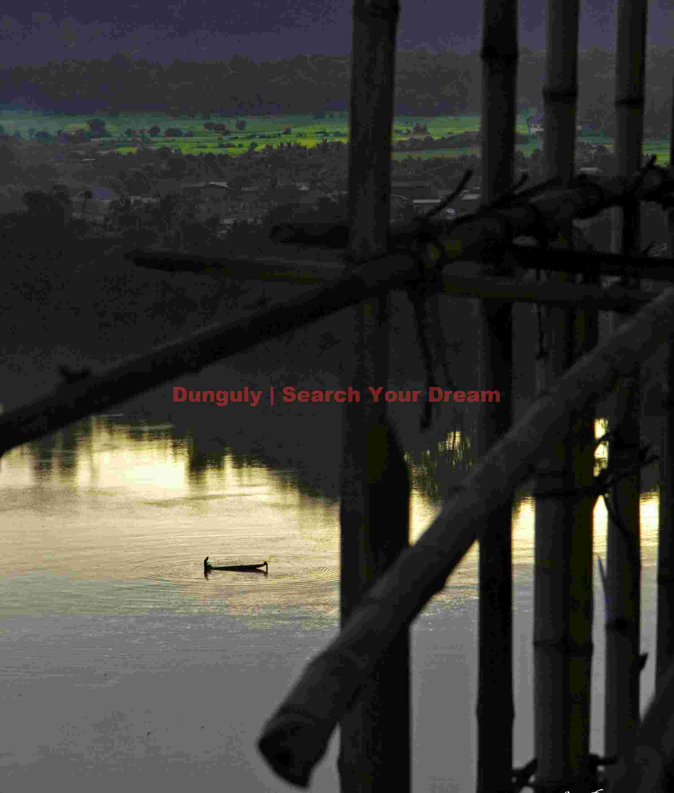 Boat on Mekong River through construction scaffold