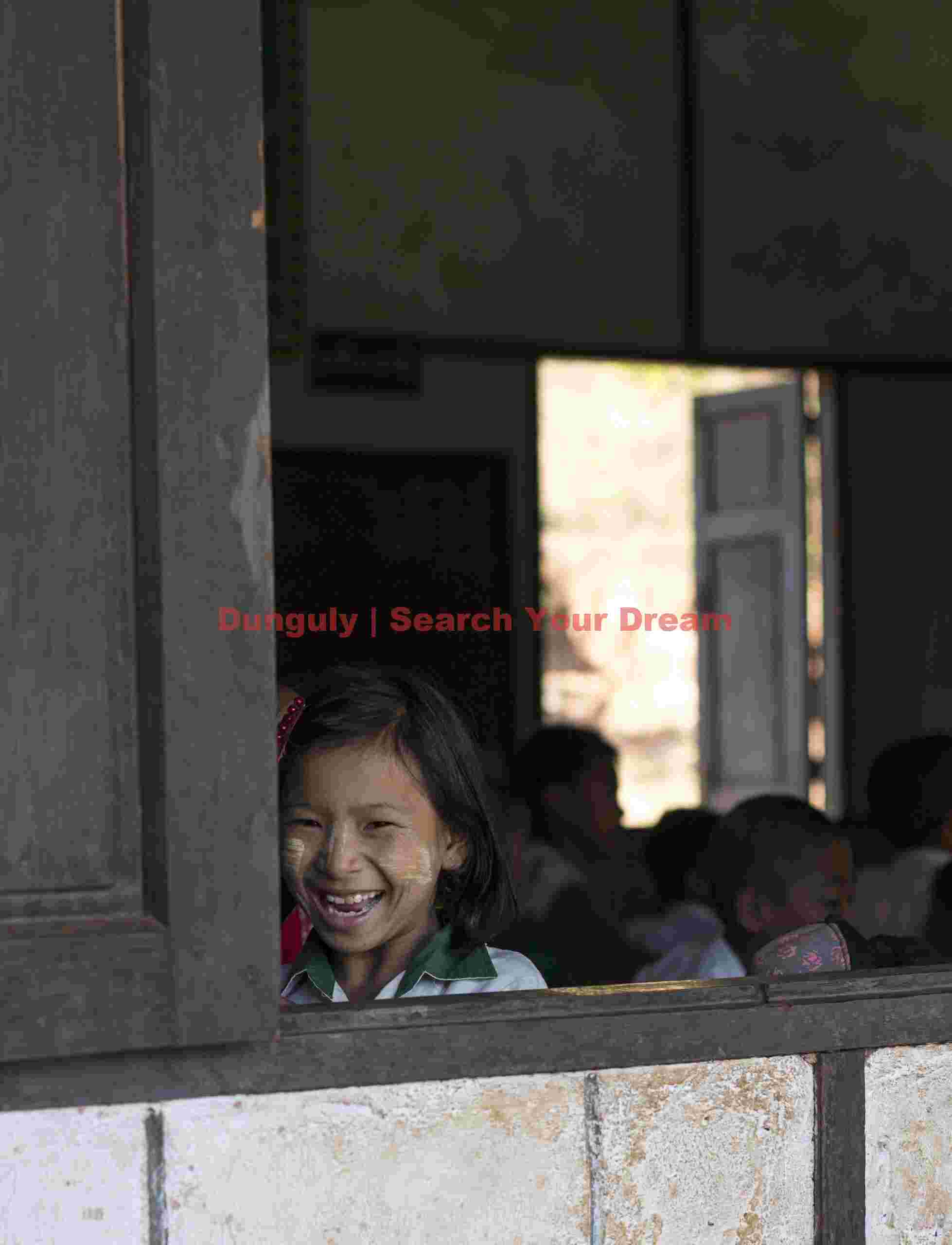 Burmese schoolgirl at window corner