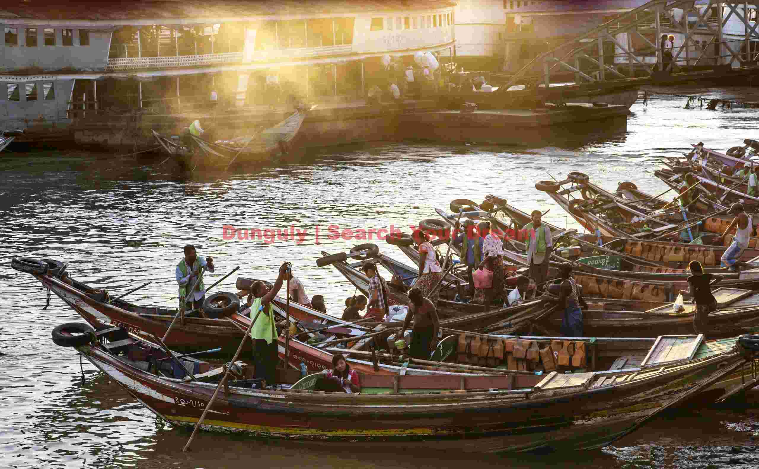 Ferry boats lined up at sunset