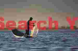 Fisherman as backlit sillhouette