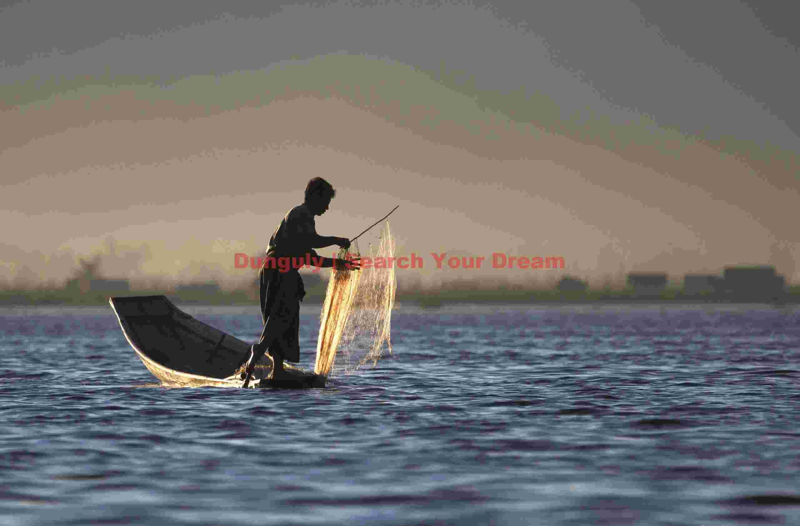 Fisherman as backlit sillhouette